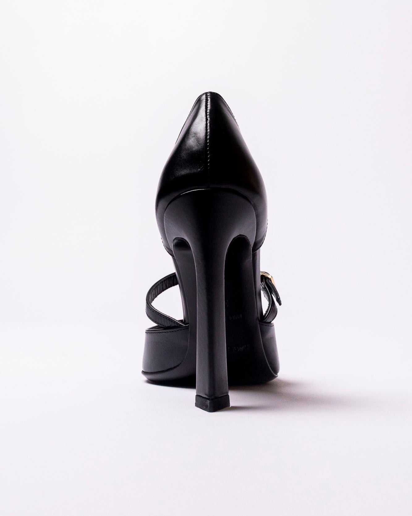 Black high-heeled shoe on a white background