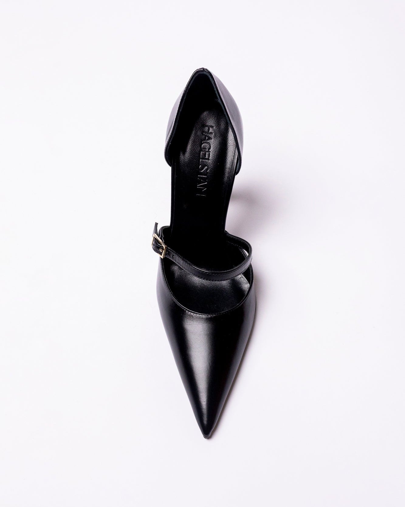 Black pointed-toe high heel shoe on a white background