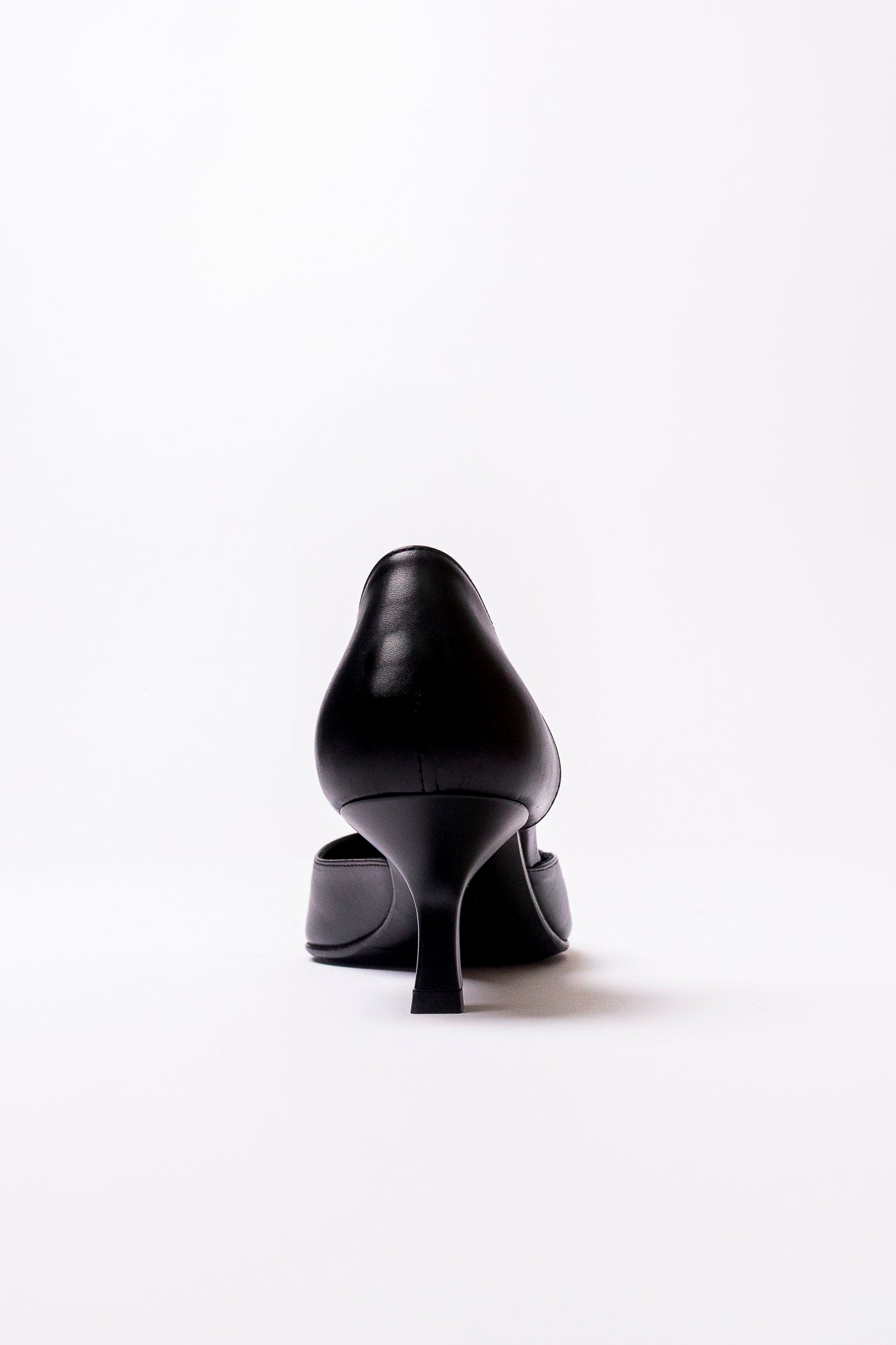 Black high-heeled shoes on a white background
