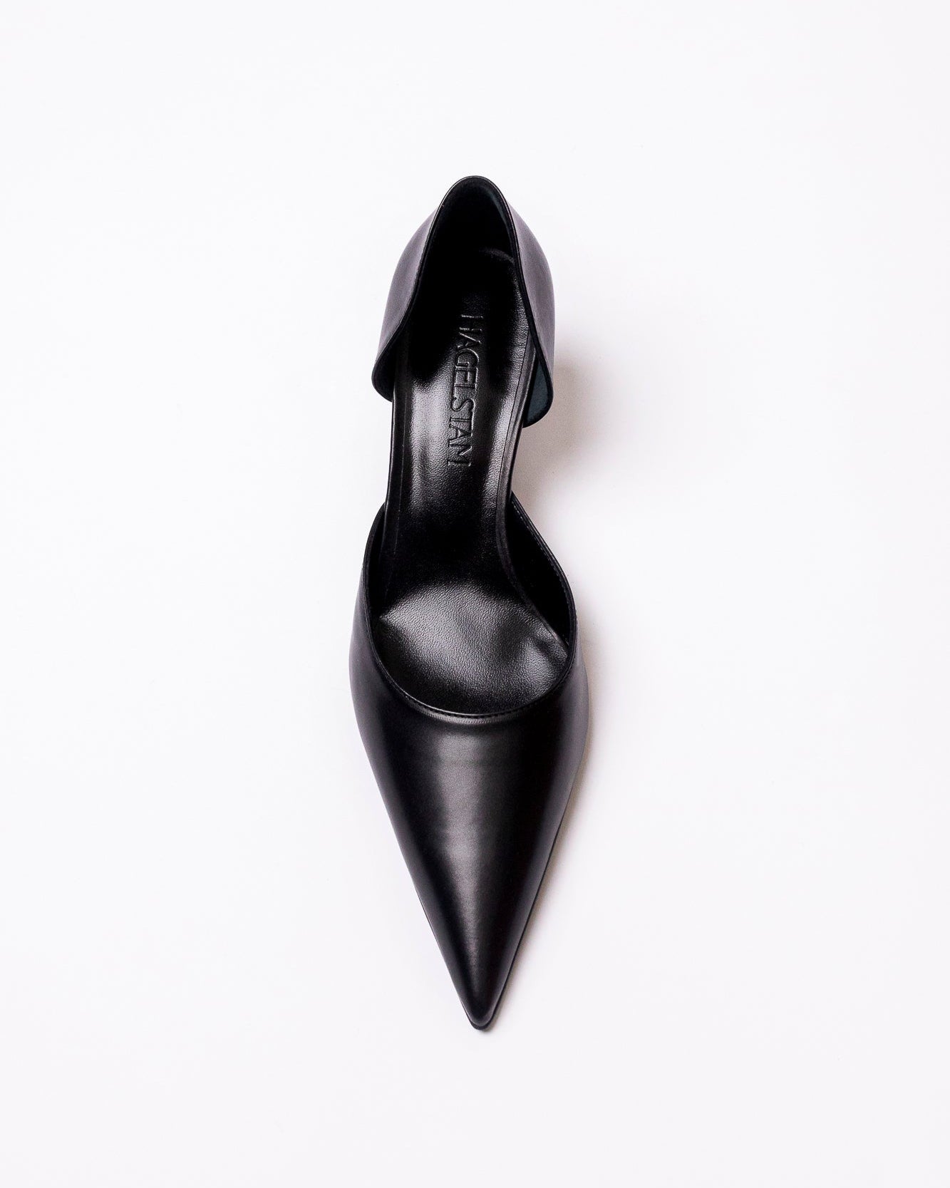 Black pointed-toe shoe on a white background