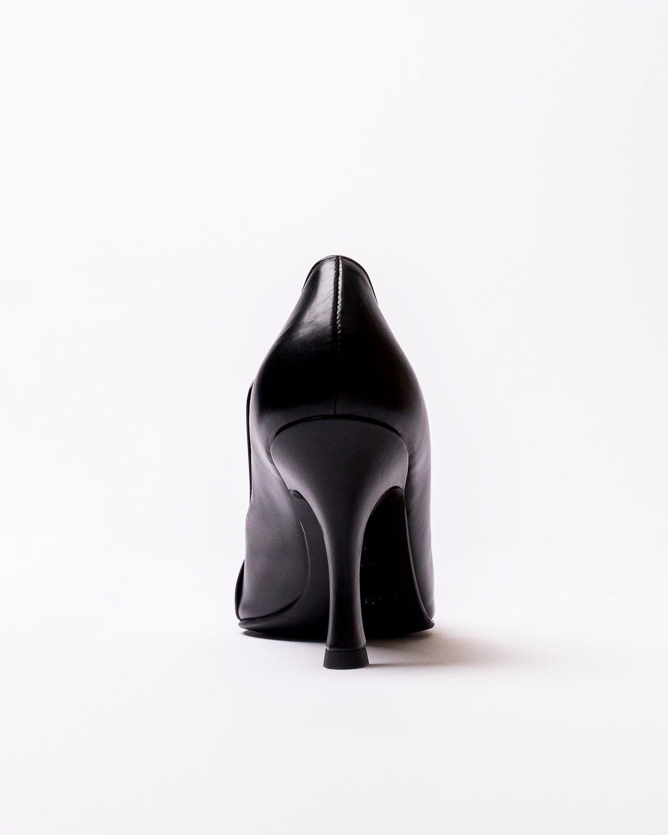 Black high-heeled shoe on a white background