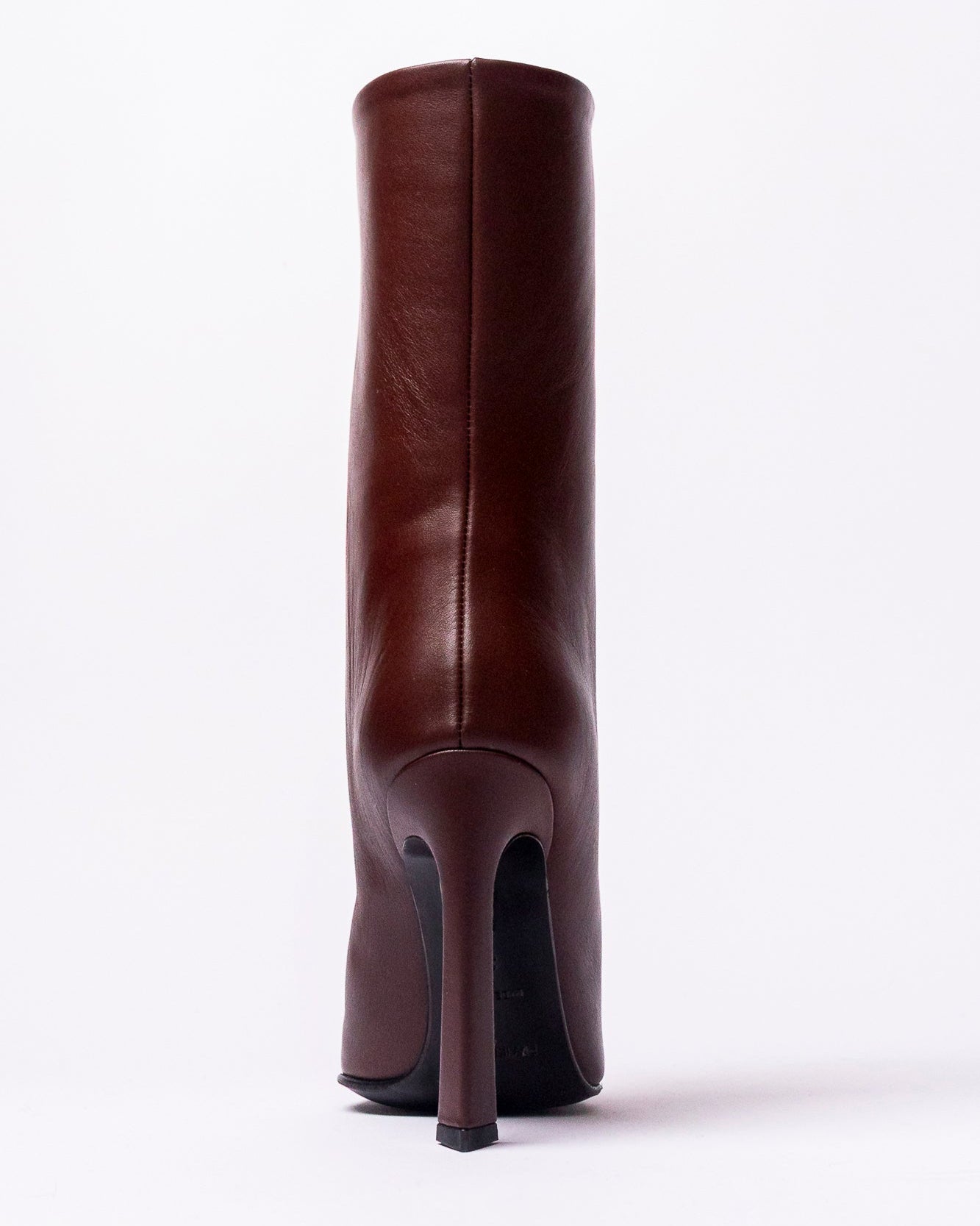 Brown leather boot on a white background