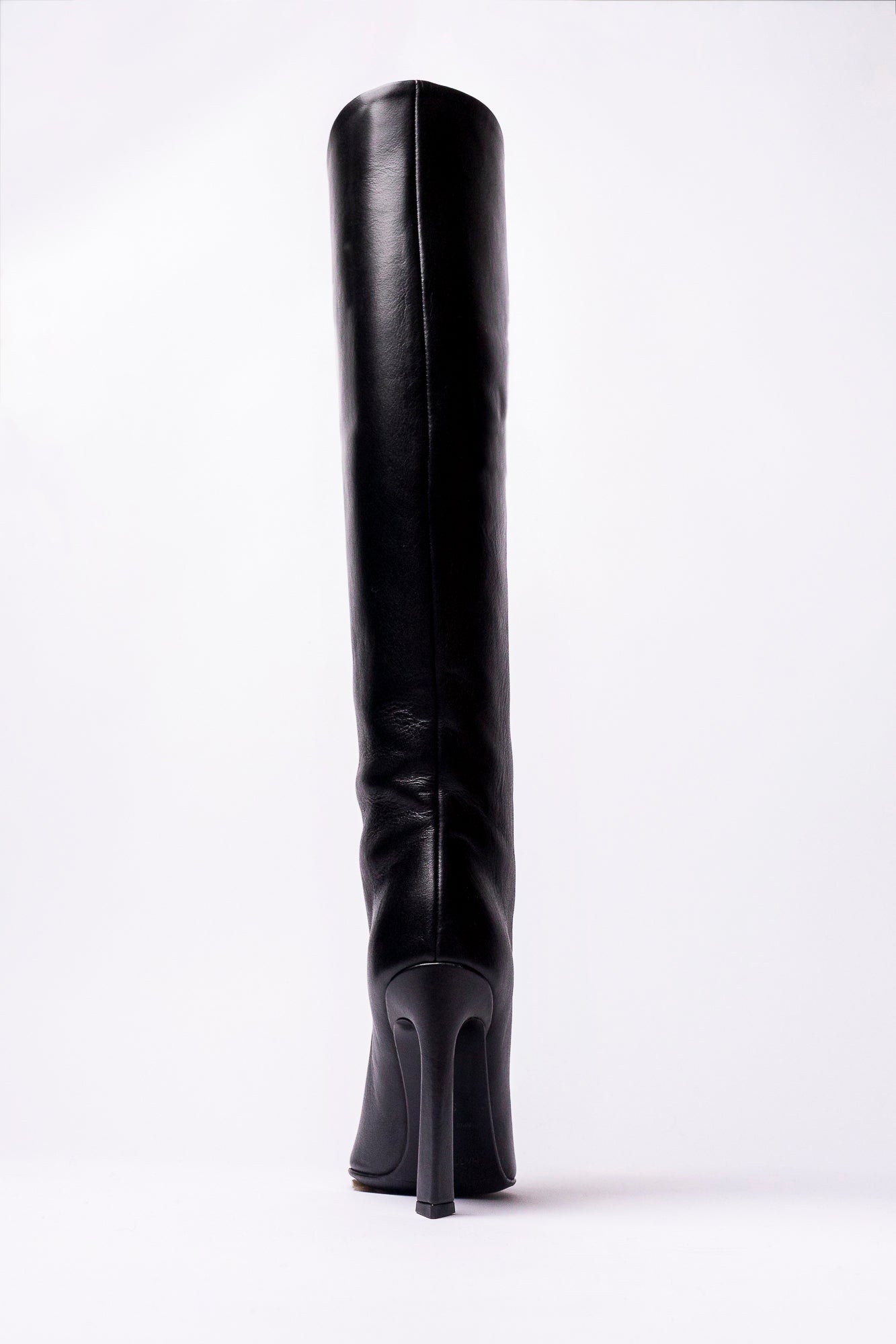 Black knee-high boot on a white background