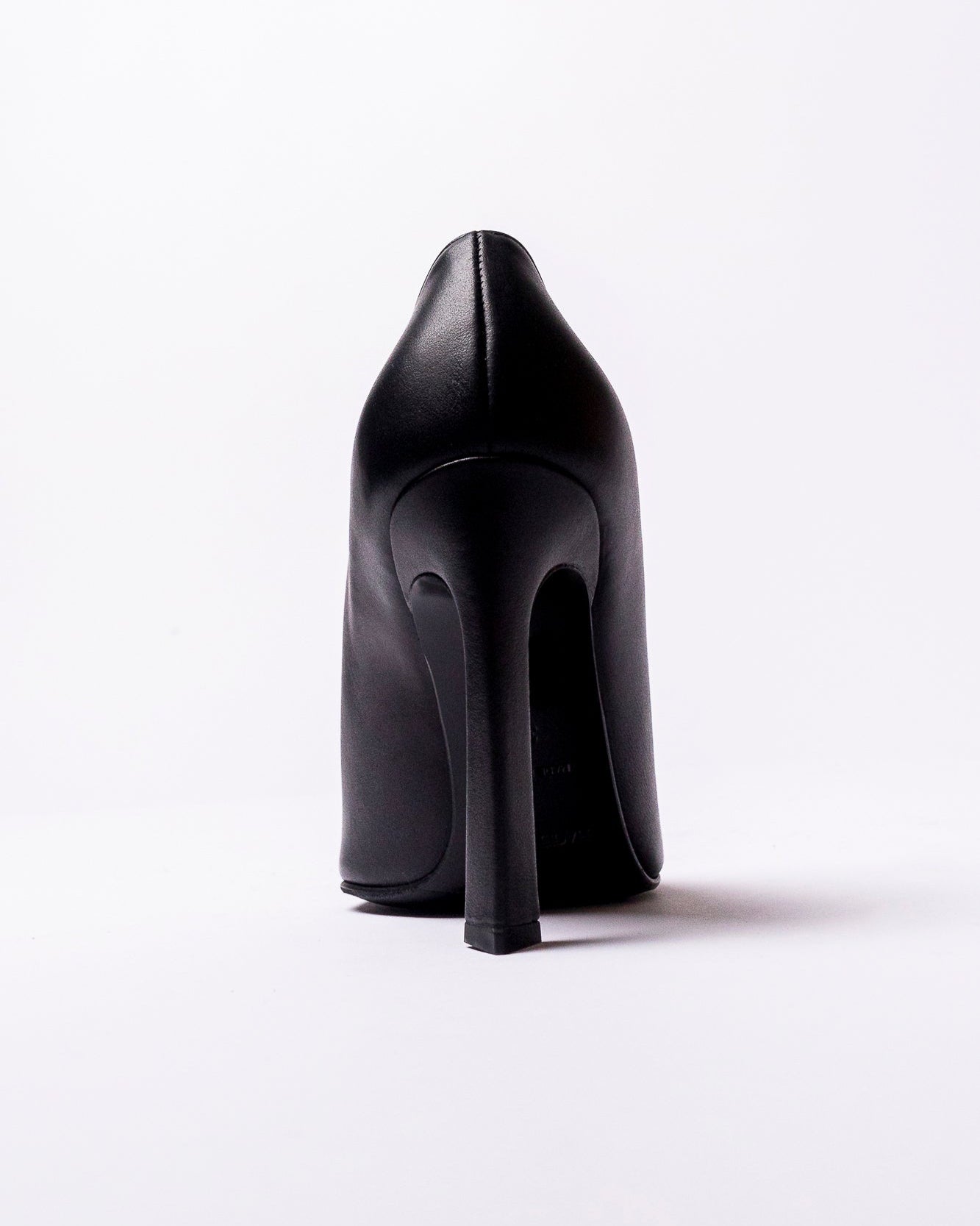 Black high-heeled shoe on a white background