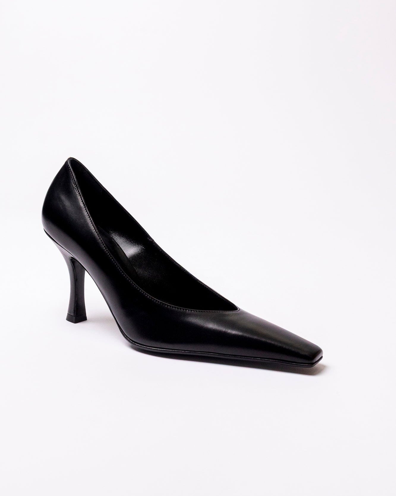Black high-heeled shoe on a white background
