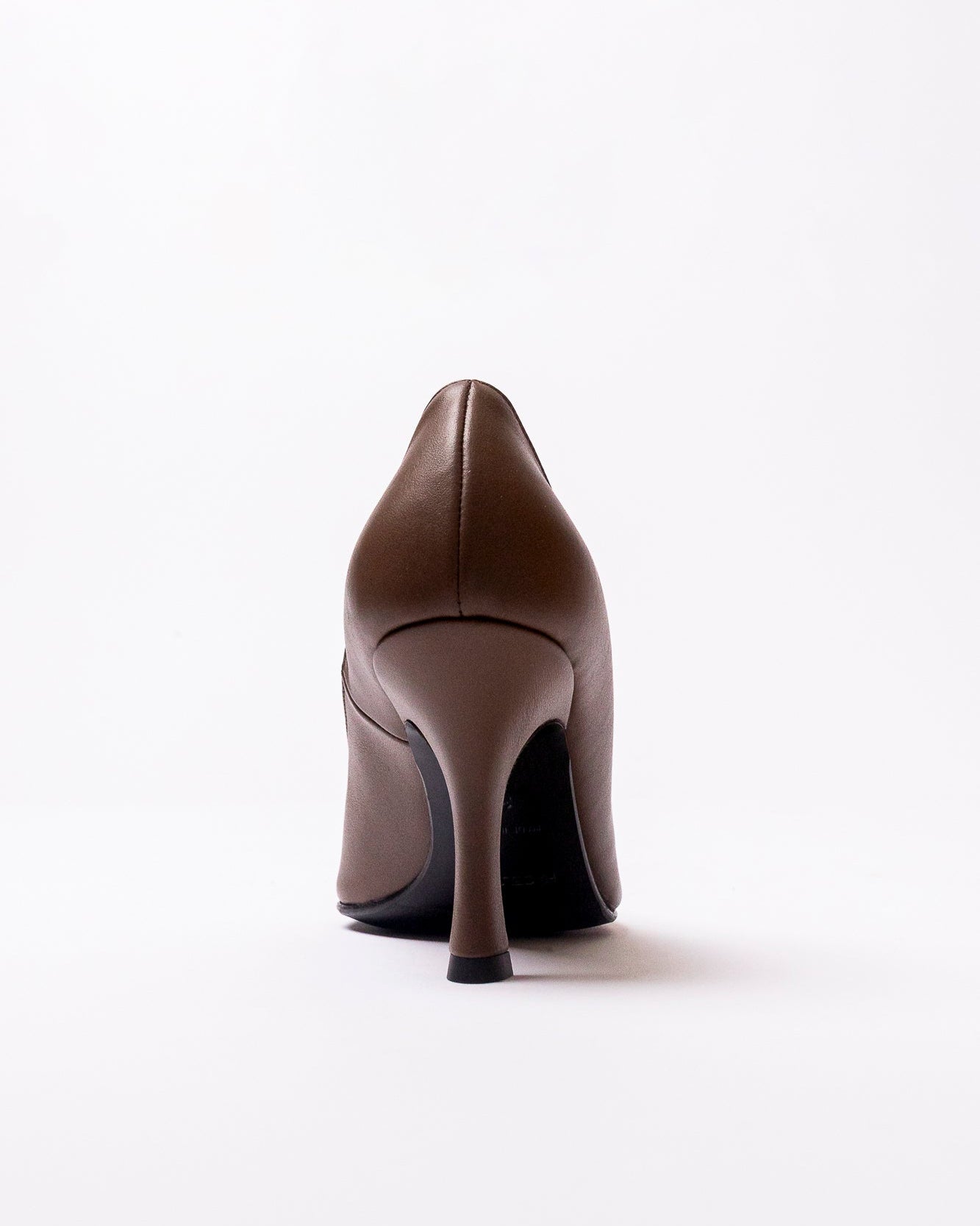Brown high-heeled shoe on a white background