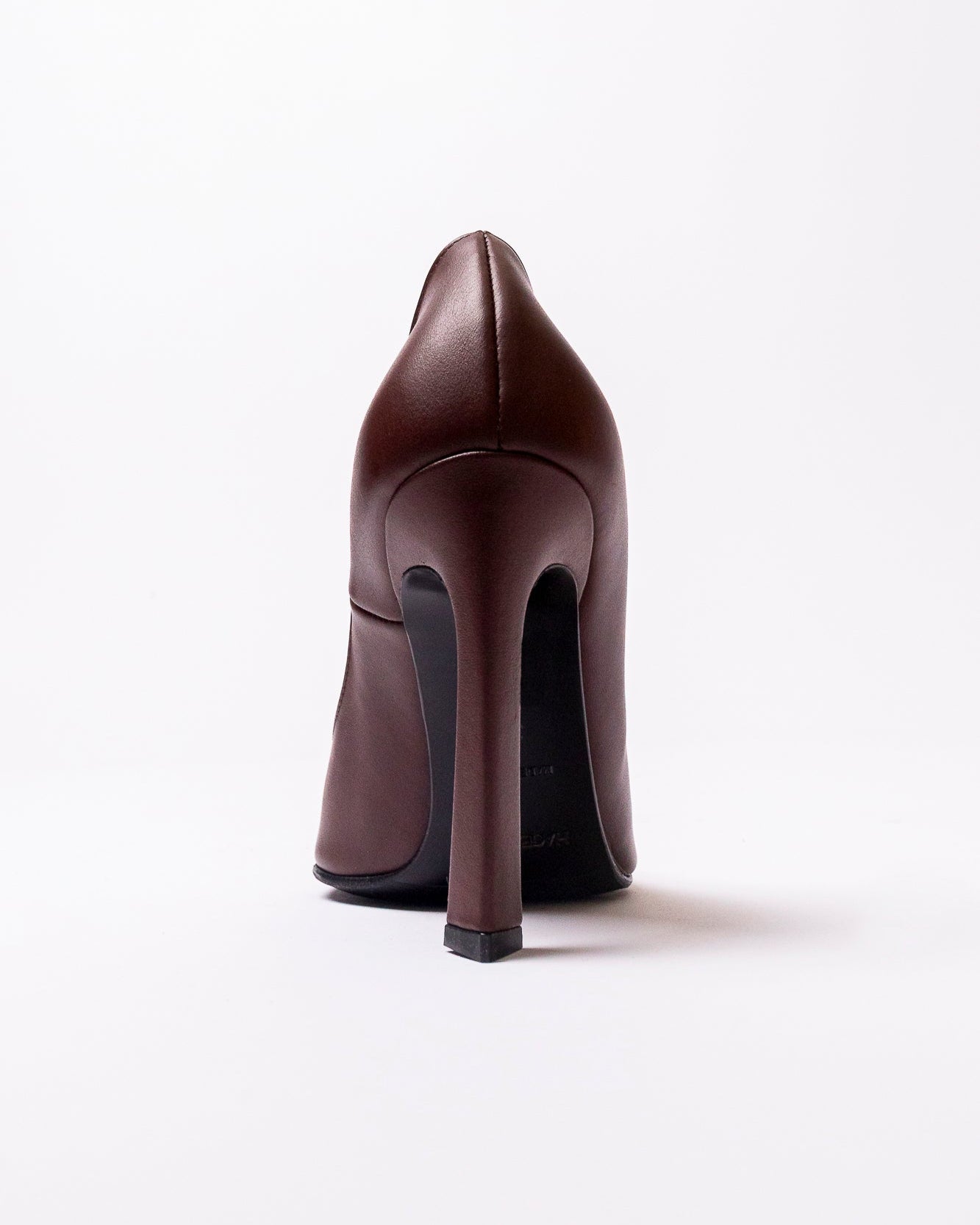 Brown high-heeled shoe on a white background