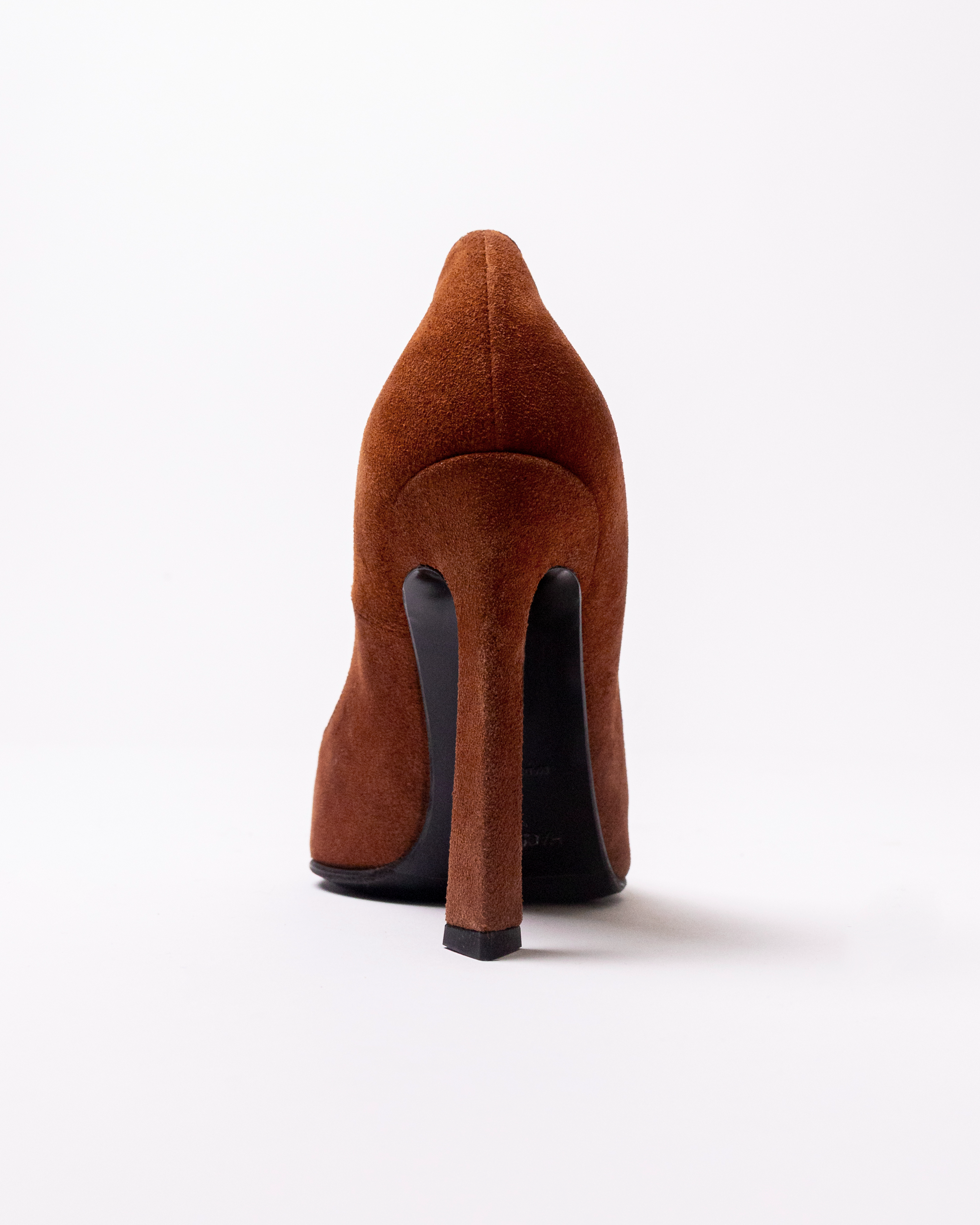 Brown suede high-heeled shoe on a white background