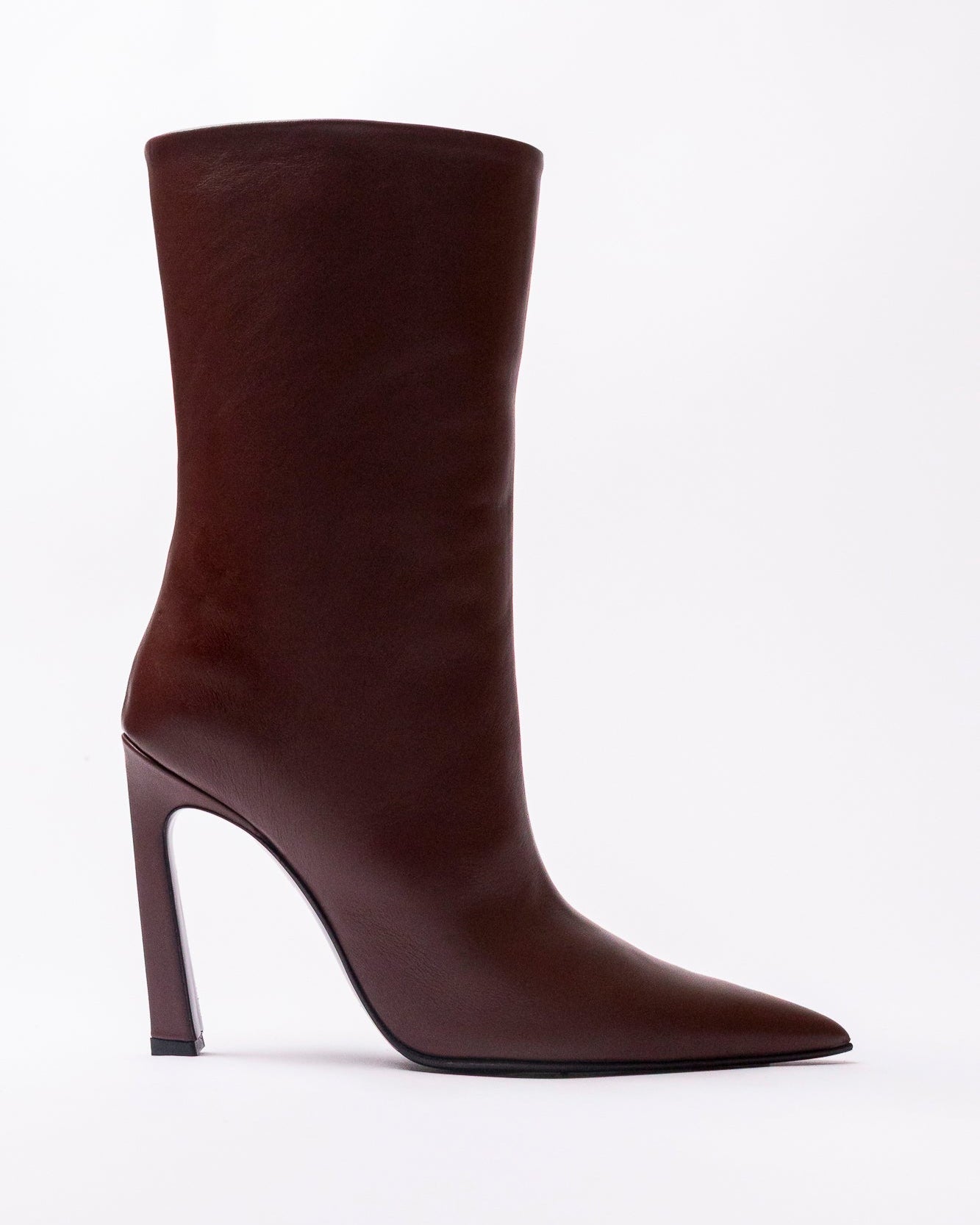 Brown knee-high boot with a high heel on a white background