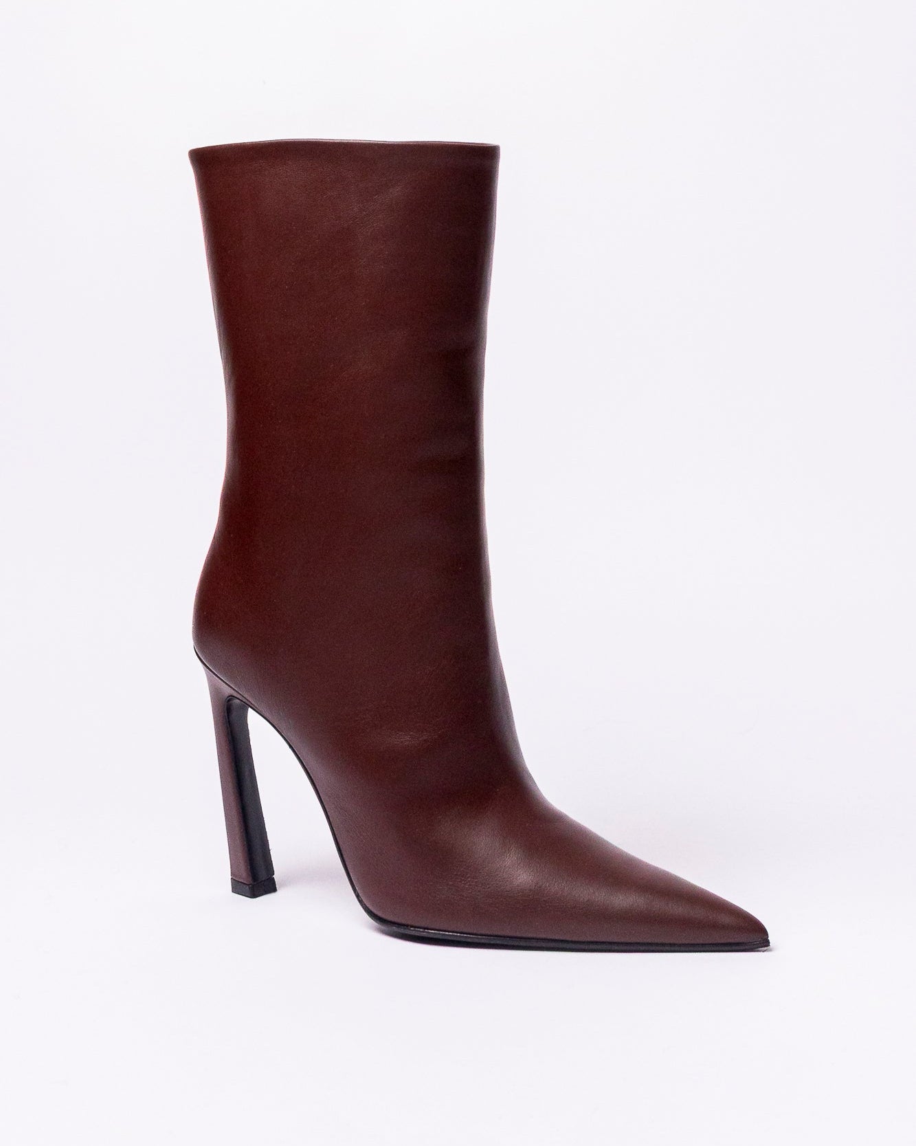 Brown knee-high boot with a high heel on a white background