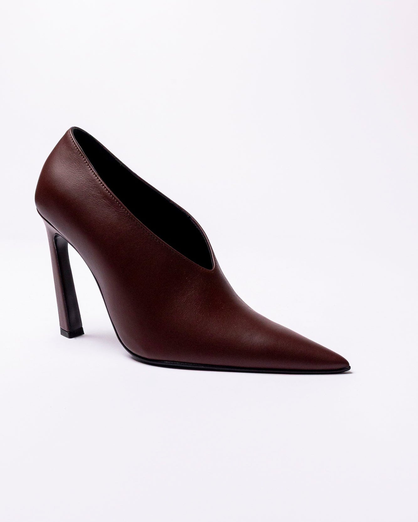 Brown high-heeled shoe on a white background