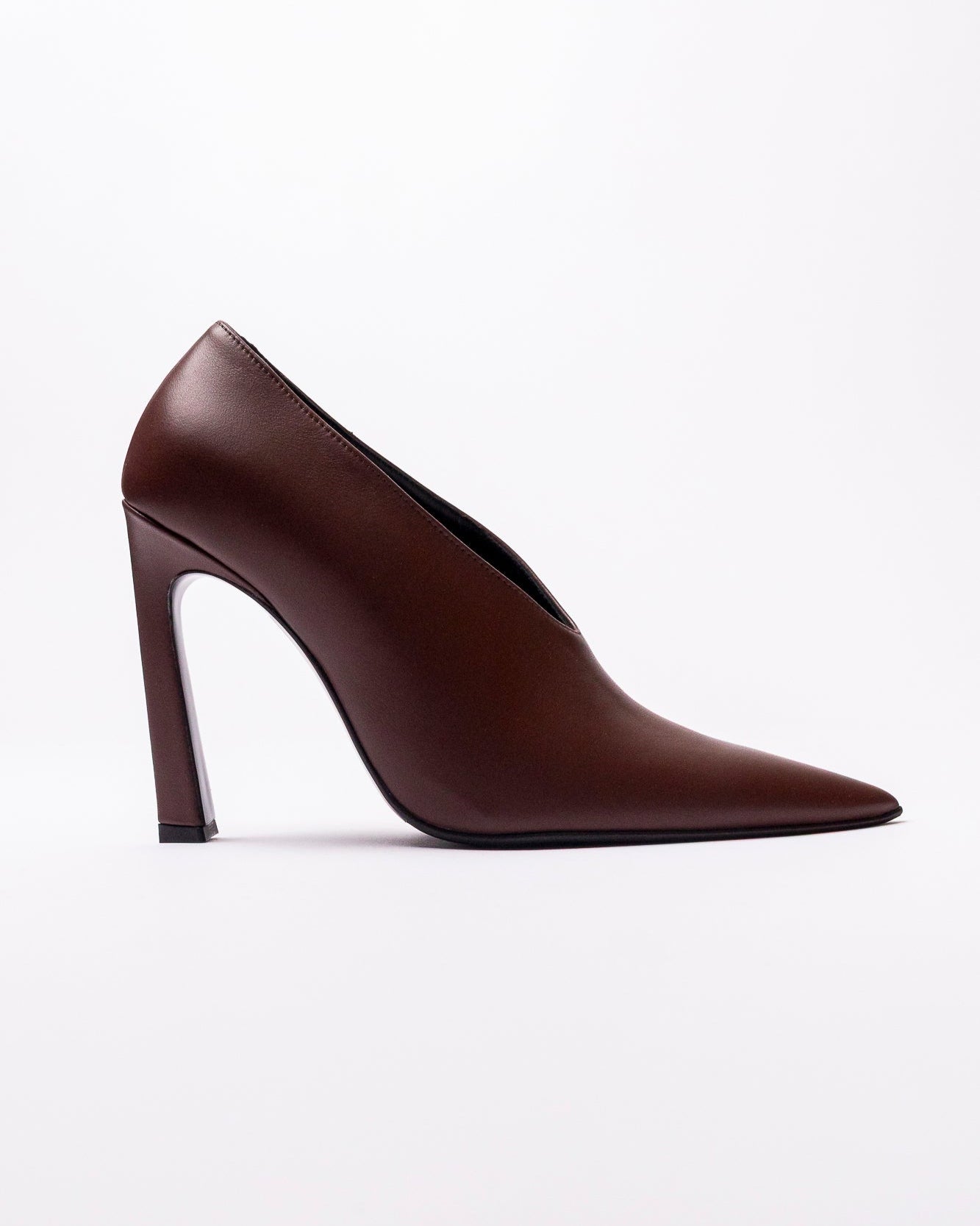Brown high-heeled shoe on a white background