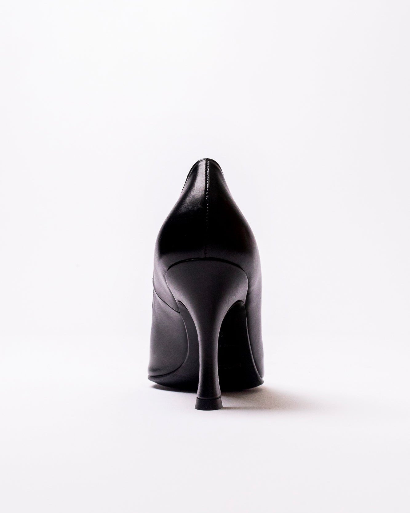 Black high-heeled shoe on a white background