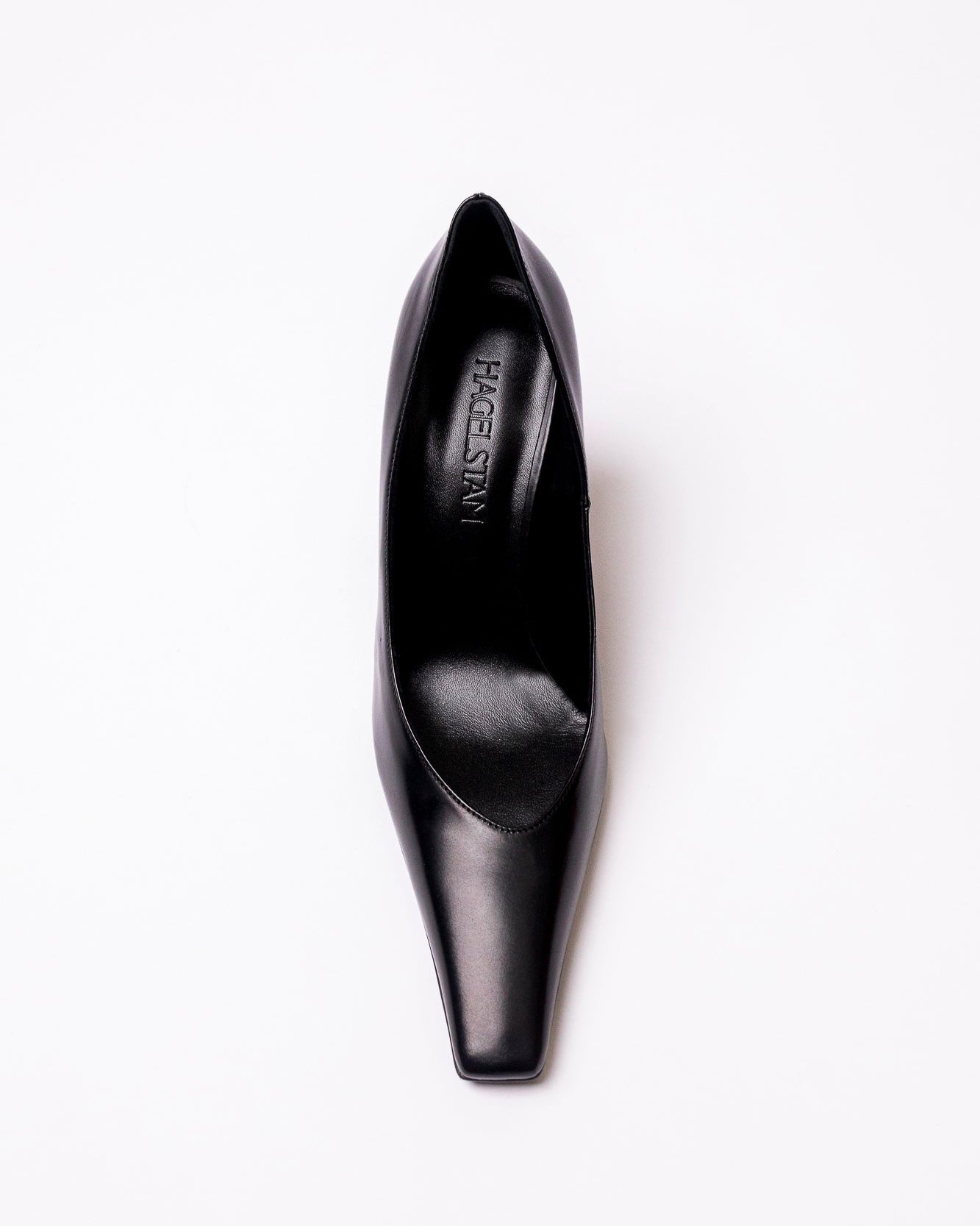 Black high-heeled shoe on a white background
