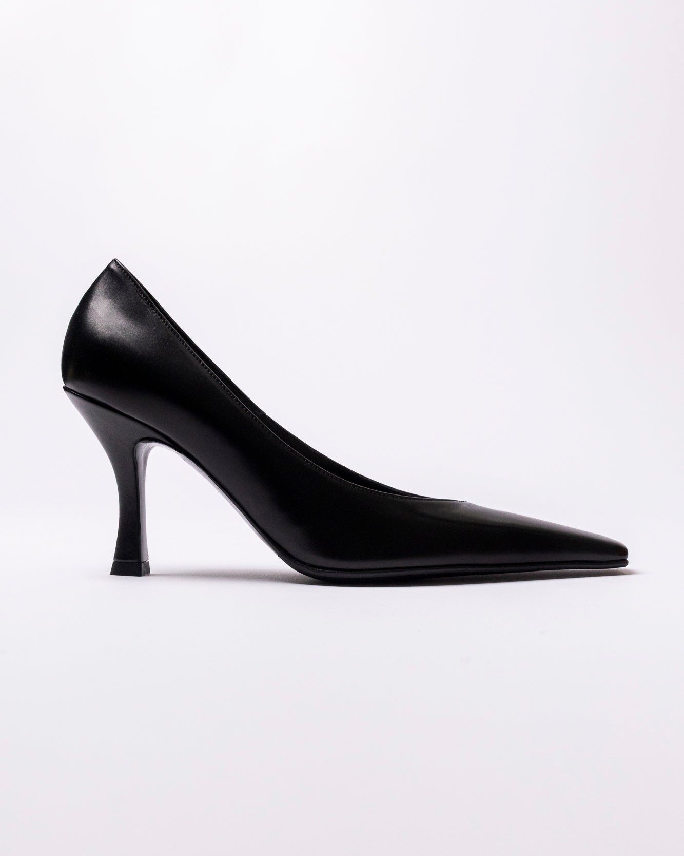 Black high-heeled shoe on a white background