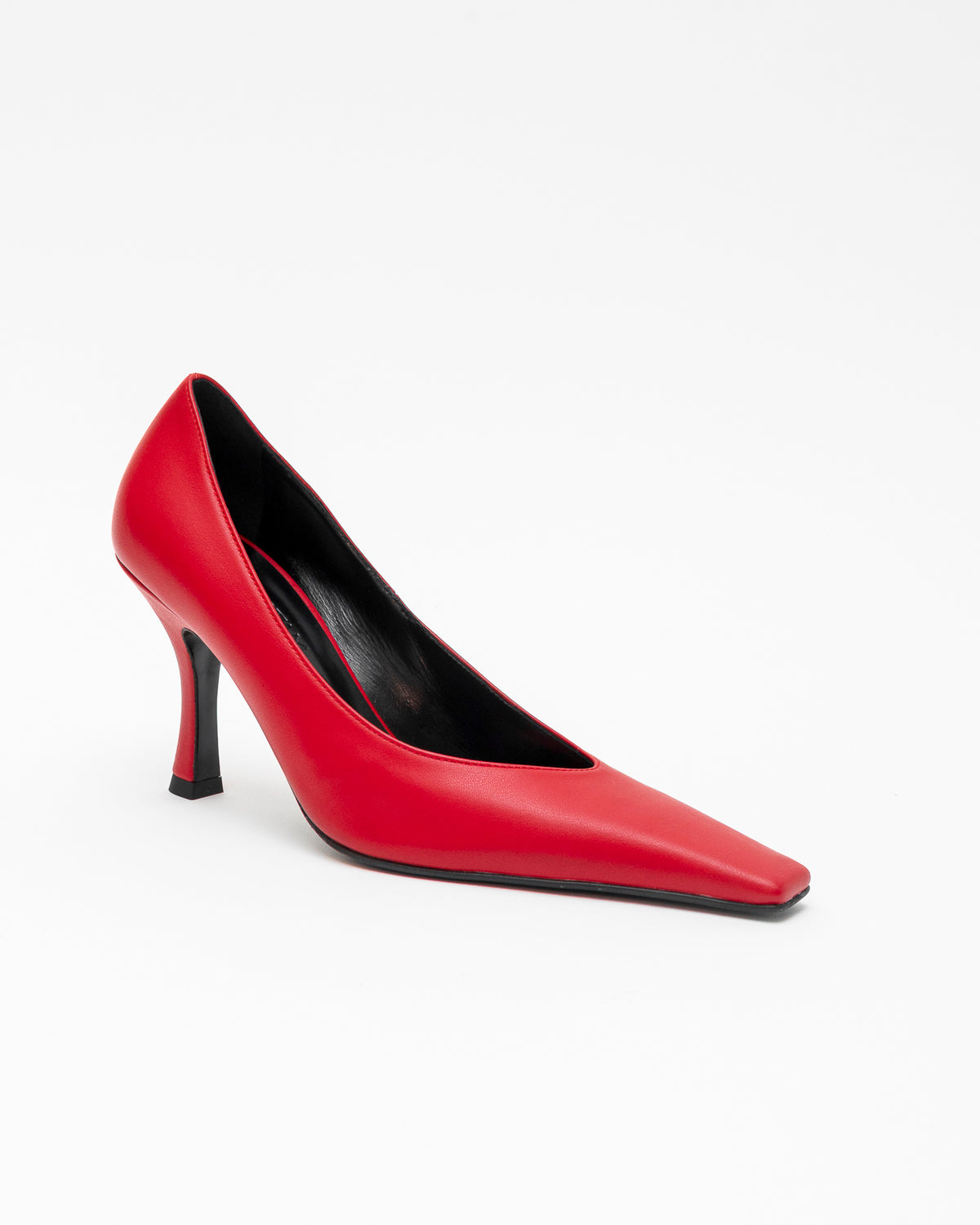 A single red pointed-toe high heel pump with a slim black stiletto heel, shown from a side profile on a clean white background.