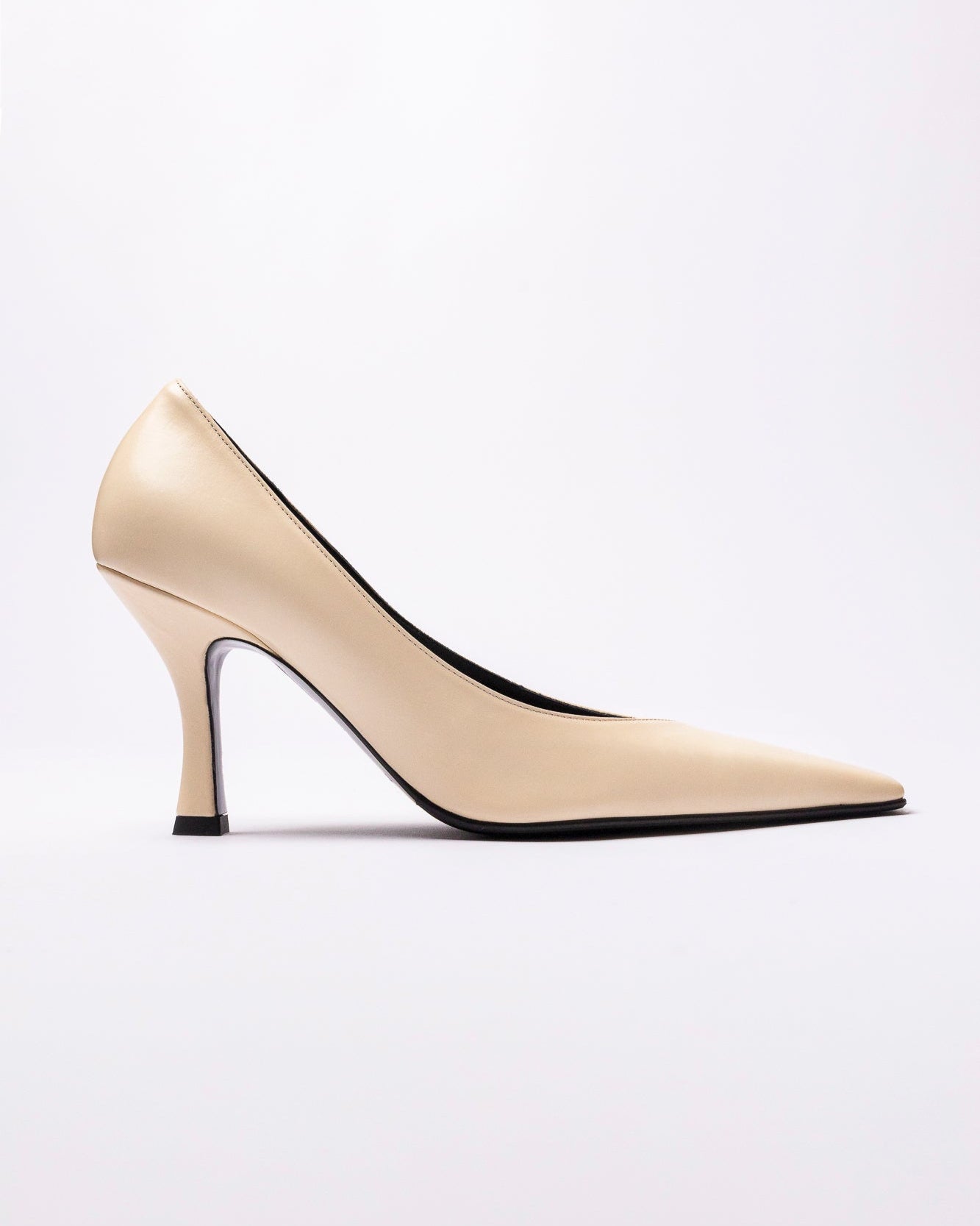 Beige high-heeled shoe on a white background