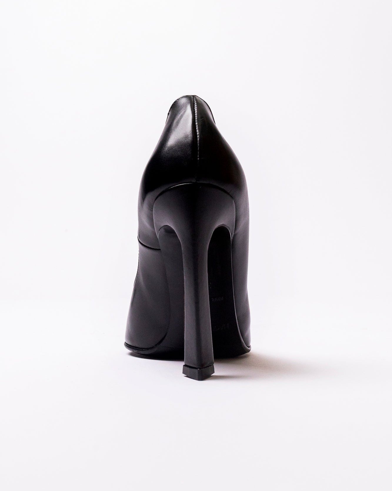 Black high-heeled shoe on a white background