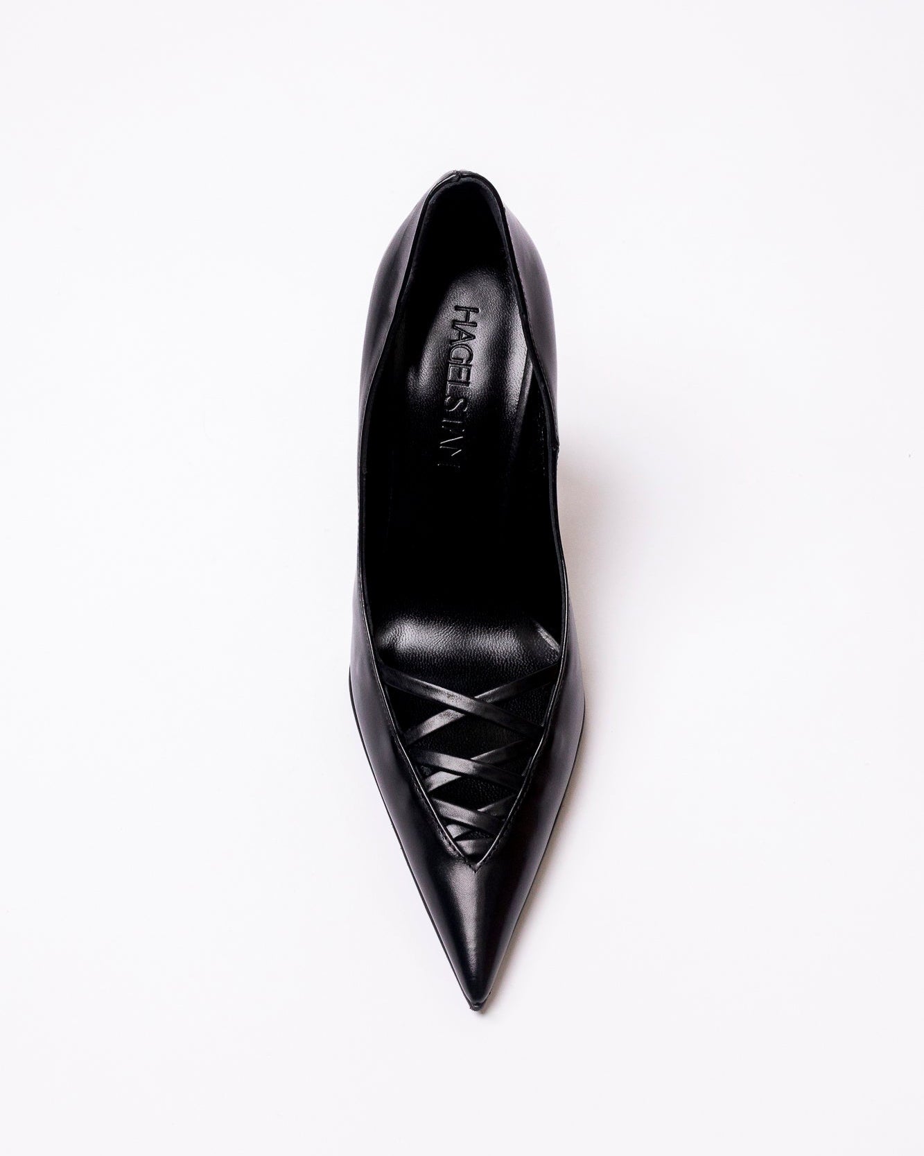 Black high-heeled shoe with a brand name on a white background